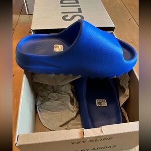Brand new Yeezy slides. Size 5 kids boys. Blue.